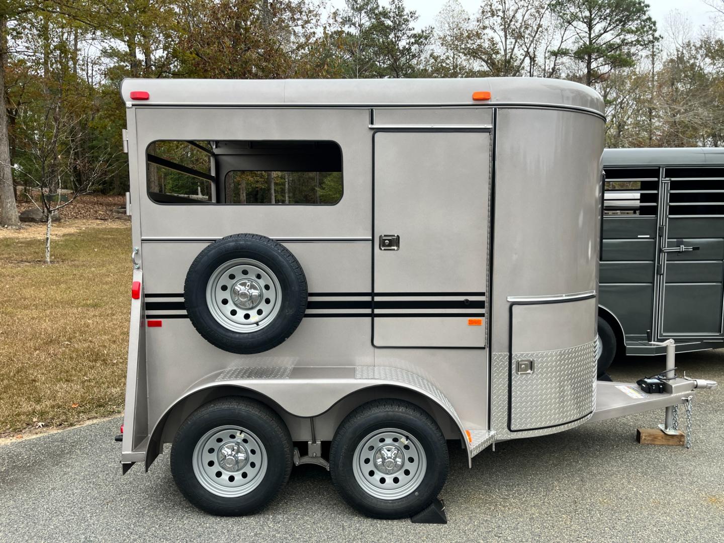 2024 Pewter Metallic Bee Trailers 2 Horse Straight Load Wrangler , located at 1330 Rainey Rd., Macon, 31220, (478) 960-1044, 32.845638, -83.778687 - Sold Special Order Only! Brand New Bee Brand 2 Horse Straight Load Wrangler Series Trailer. Super Deluxe 6ft X 10ft Outside Model is 7ft Tall for Larger Horses too! Made Using Rust Resistant Galvanneal Steel Made in USA! Escape Door and Huge Tack Area, w/Sliding Saddle Rack! Tandem 3,500lb Spri - Photo#1