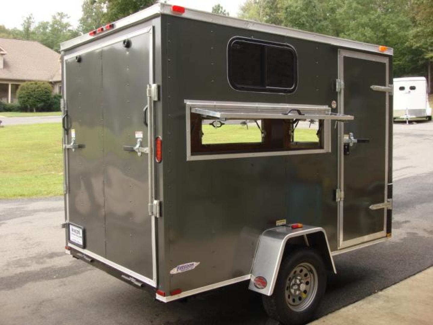 2023 Charcoal Metallic Freedom 6ft X 10ft Hunting Trailer , located at 1330 Rainey Rd., Macon, 31220, (478) 960-1044, 32.845638, -83.778687 - We Sold This Trailer to a Customer in Tennessee, for His Handicapped Son to Hunt Inside! We Could Special Order You One in About 6 Weeks! Call for Current Price! This Price can Vary! Brand New Enclosed Hunting Trailer! Haul Your ATV and Then Hunt From The Same Trailer! Stay Warm & Dry Whil - Photo#9