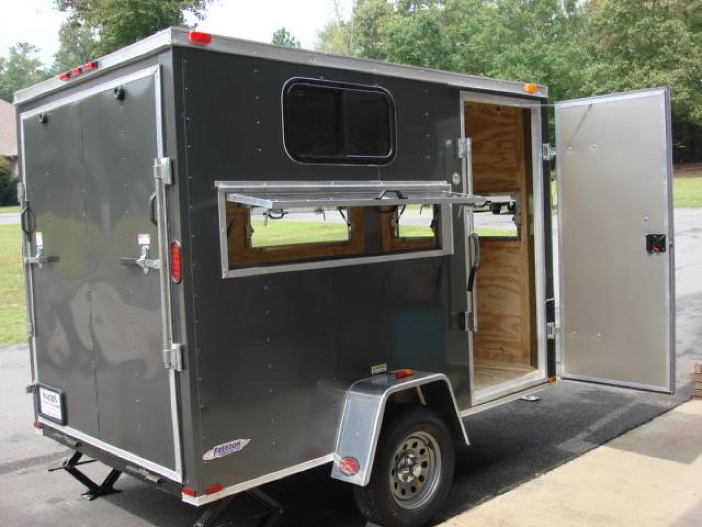 2023 Charcoal Metallic Freedom 6ft X 10ft Hunting Trailer , located at 1330 Rainey Rd., Macon, 31220, (478) 960-1044, 32.845638, -83.778687 - We Sold This Trailer to a Customer in Tennessee, for His Handicapped Son to Hunt Inside! We Could Special Order You One in About 6 Weeks! Call for Current Price! This Price can Vary! Brand New Enclosed Hunting Trailer! Haul Your ATV and Then Hunt From The Same Trailer! Stay Warm & Dry Whil - Photo#20